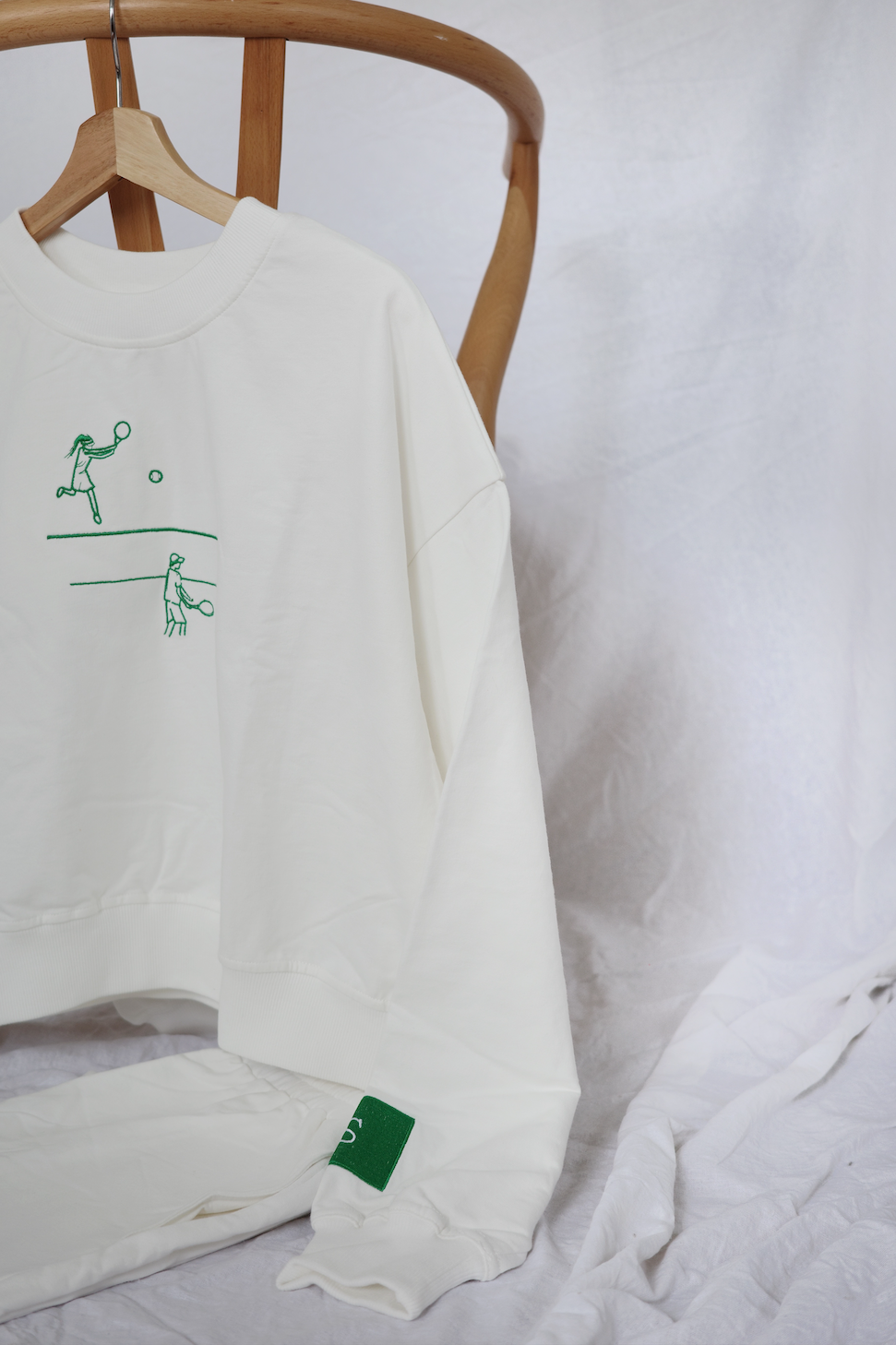 "tennis set, Padel, padel clothing ,pickeball, loungwear, comfortable loungewear, tennis outfit, womens fashion, mens fashion, loungewear sets, embroidered clothing, hand drawn embroidery, tennis hoodie, tennis sweater, lifestyle clothing, menswear, womenswear, best loungewear brands, pickleball jumper".